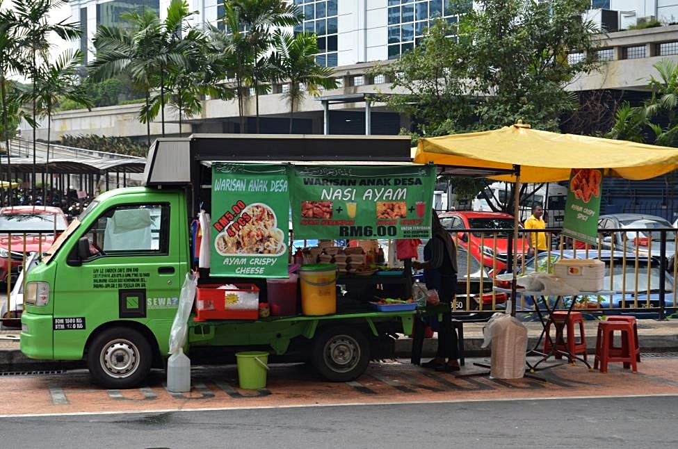 Street food on every corner. Truck as a food stall, Kuala Lumpur Downtown