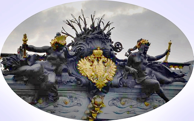 Alexander III Bridge detail with two female statues and gilded two headed eagle coat of arms in the middle, Paris