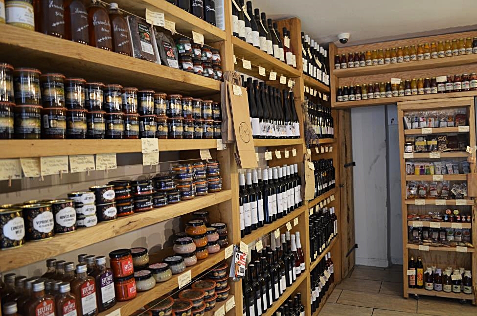 Moravian products shop with shelves full of jams, spices, cold cuts and wines, Mikulov