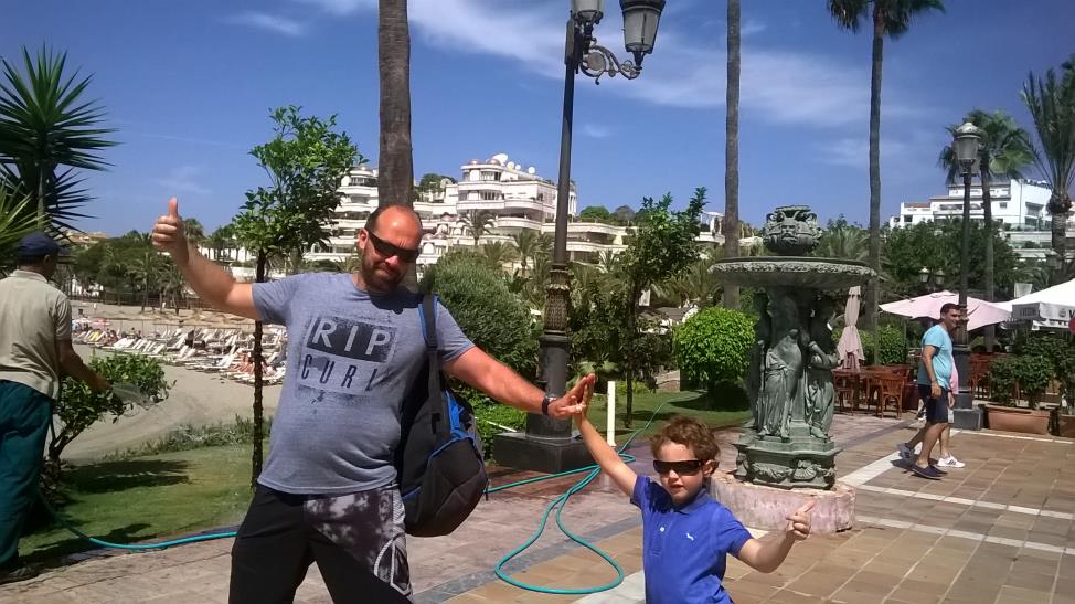 Puerto Banus fun time, Andalusia. My son and I posing with luxury villas and palm trees behind