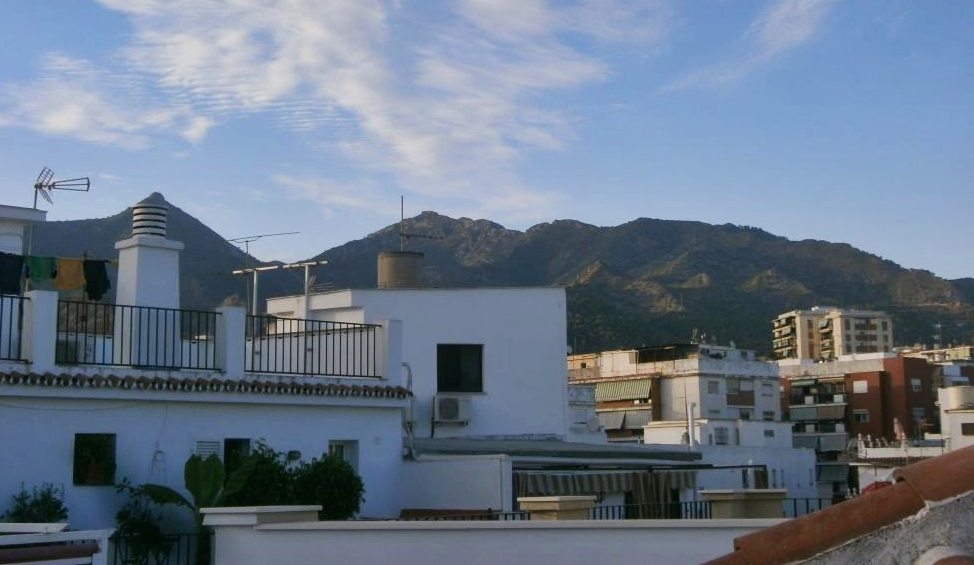 Rooftops of Marbella with sunrise, seen from our studio