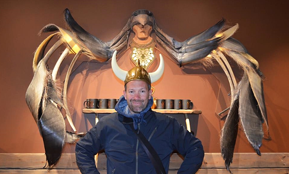 Among Vikings and Norse Mythology, Reykjavik. I am standing in a souvenir shop with Viking's helmet with wings of the Norse Goddess behind