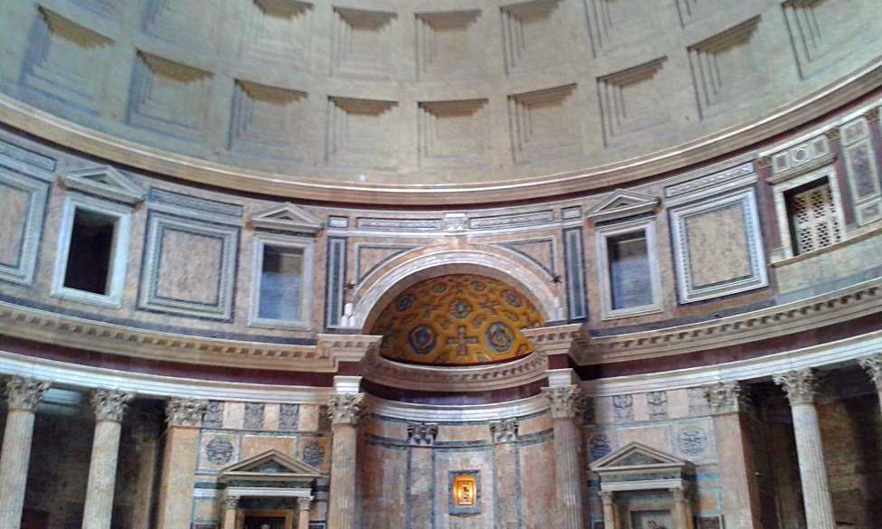 Impressive interior of the Pantheon with part of the dome and polychrome side chapels
