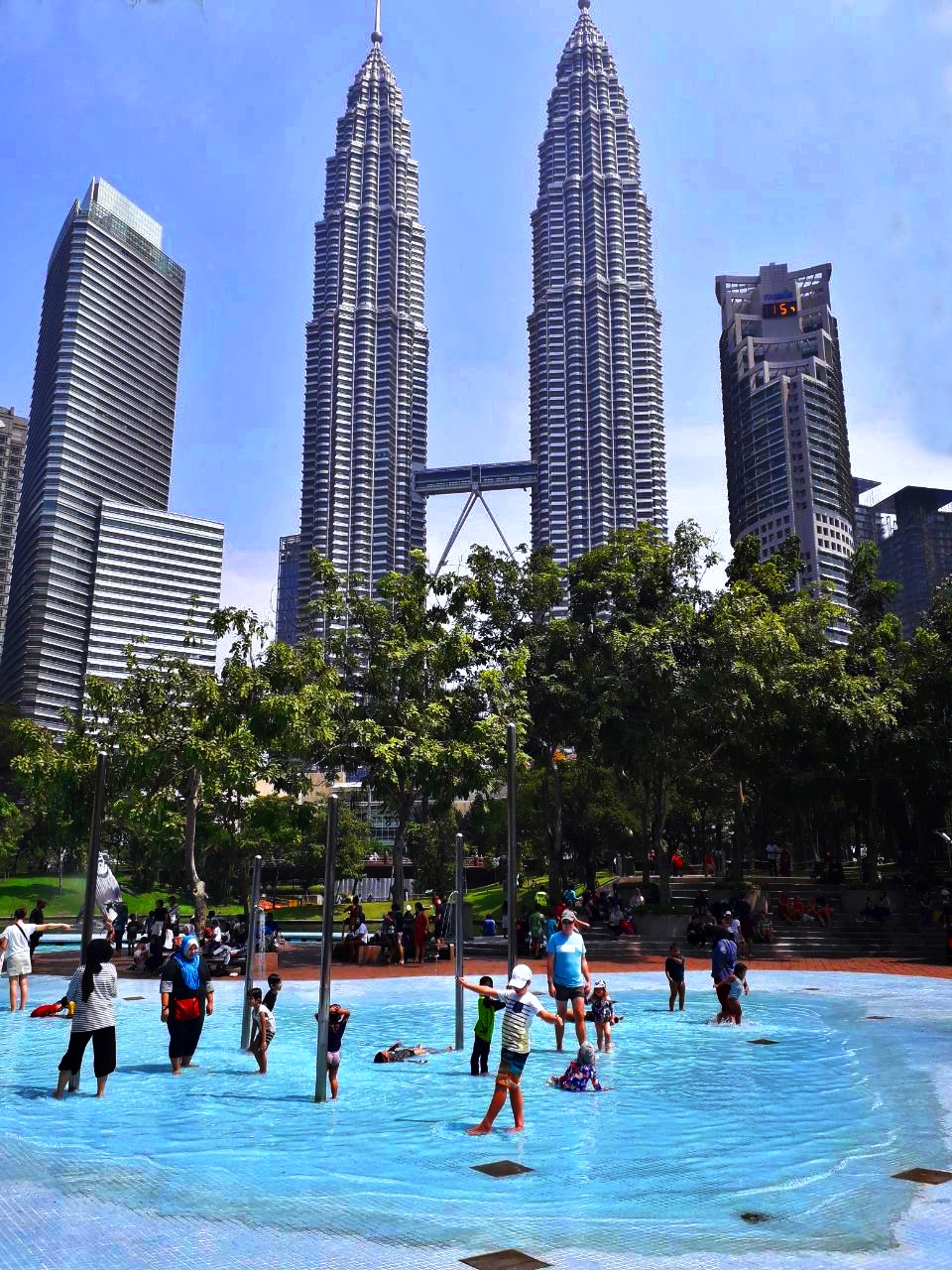 Refreshing kids pool in KL Eco Park overlooked by Petronas Towers