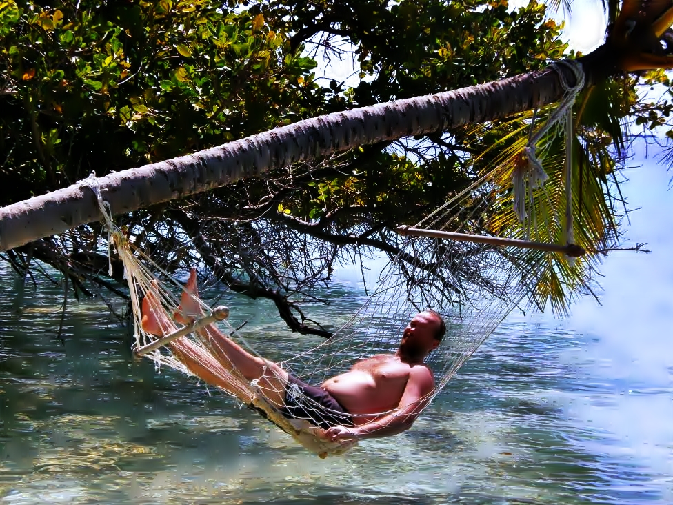 One beer, and I need some Maldivian rest. I am napping in a palm tree swing
