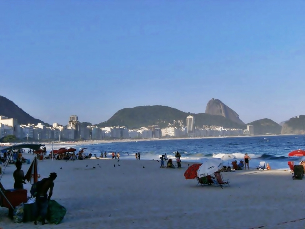 Vibrant atmosphere on Copacabana beach with local vendors and tourists
