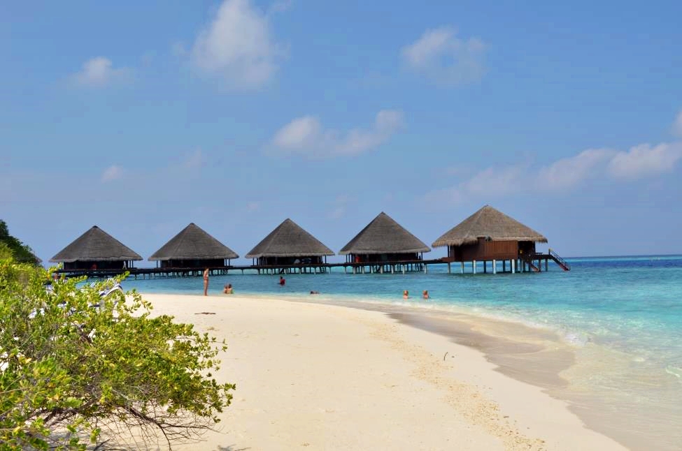 Water bungalows and crystal clear waters on the Filhalohi Island beach