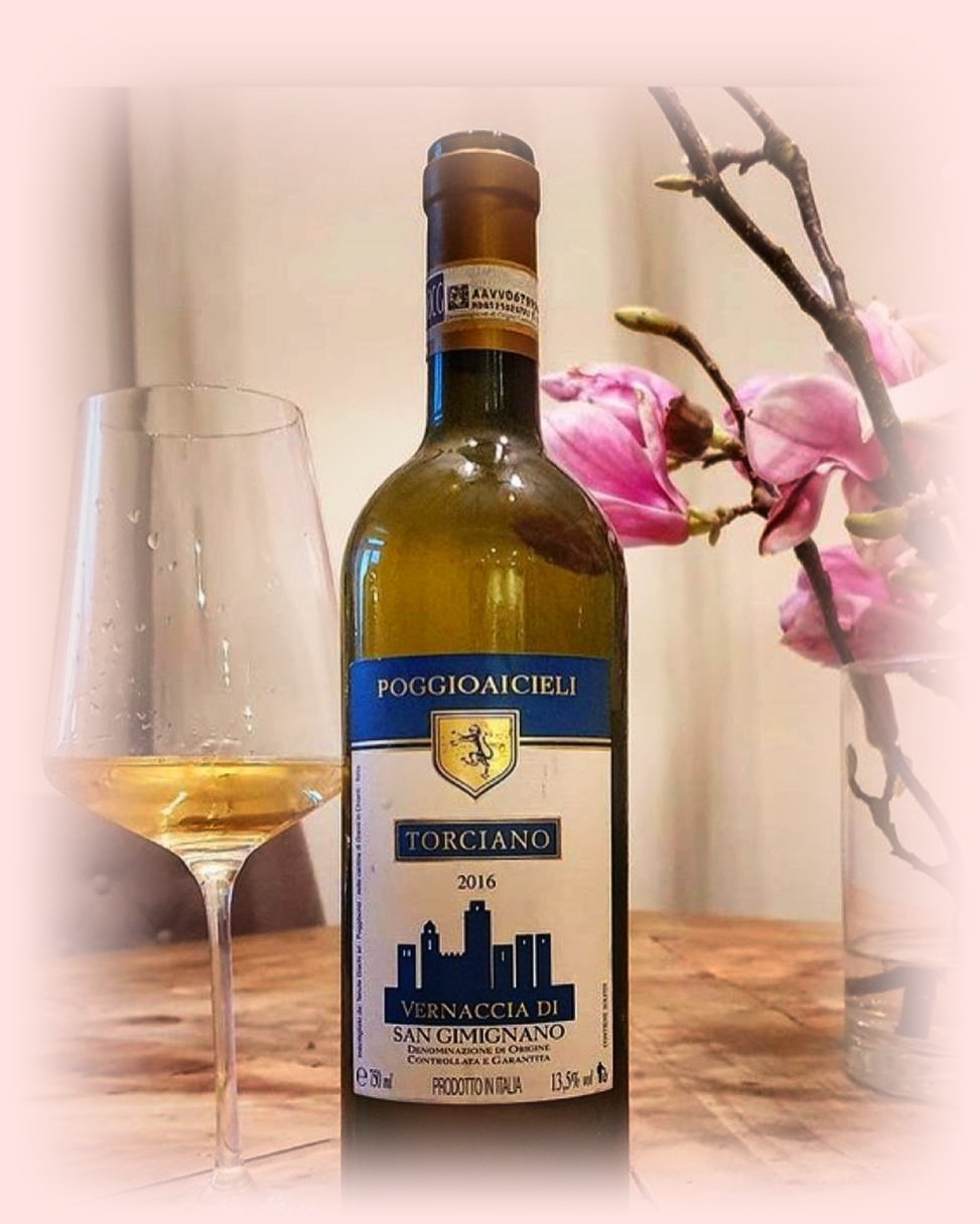 Bottle and a glass of Vernaccia di San Gimignano, famous white wine