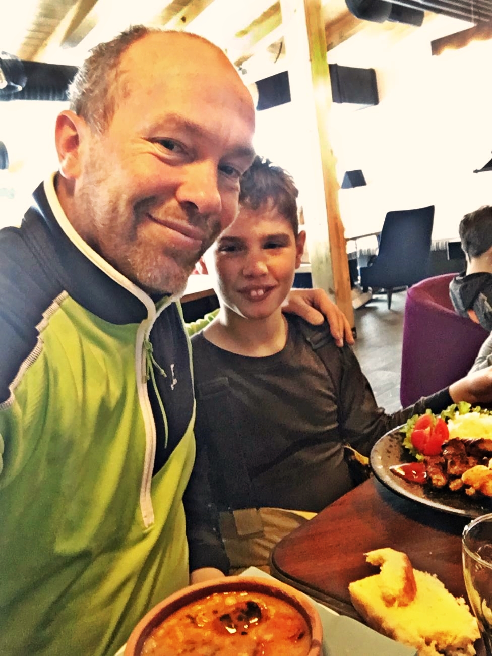 My son and I enjoying tasty lunch at Olimpijski Bar Jahorina